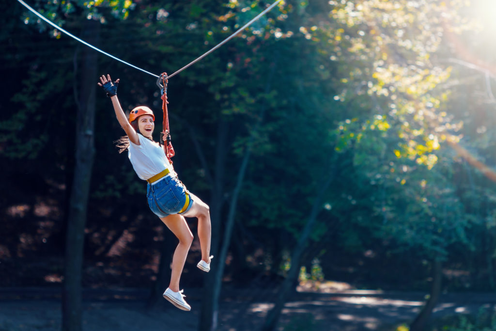 Student on a zip line outside